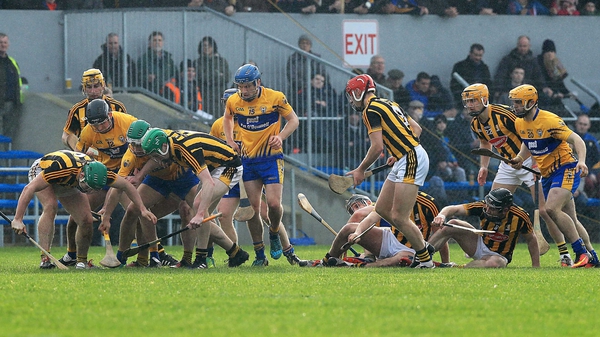 Kilkenny and Clare players battle for possession