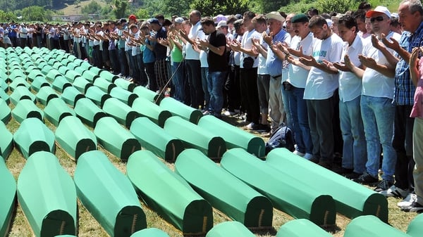Survivors of Srebrenica's 1995 massacre pray for their relatives, at a memorial cemetery in Potocari in July 2016