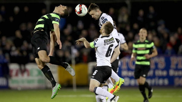 Dundalk's Robbie Benson and David McAllister of Rovers rise for a header