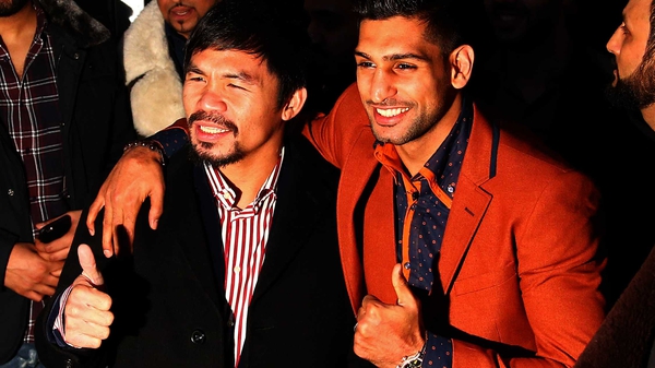 Manny Pacquiao (L) with Amir Khan