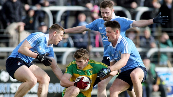Donegal's Eoghan Ban Gallagher is tackled by Dublin's John Small, Jack McCaffrey and Eric Lowndes