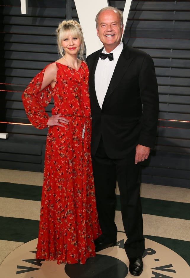 Kayte Walsh wears a cold shoulder red dress when she posed with hubby Kelsey Grammer.