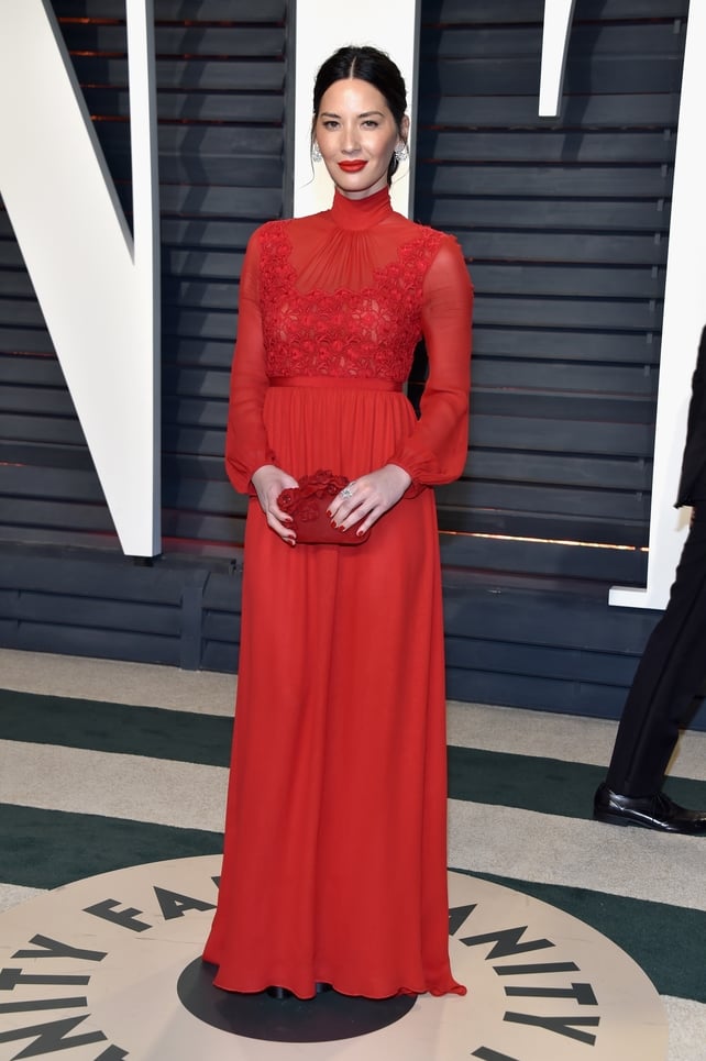 Olivia Munn wore a beautiful red Giambattista dress with matching red lips and bag.