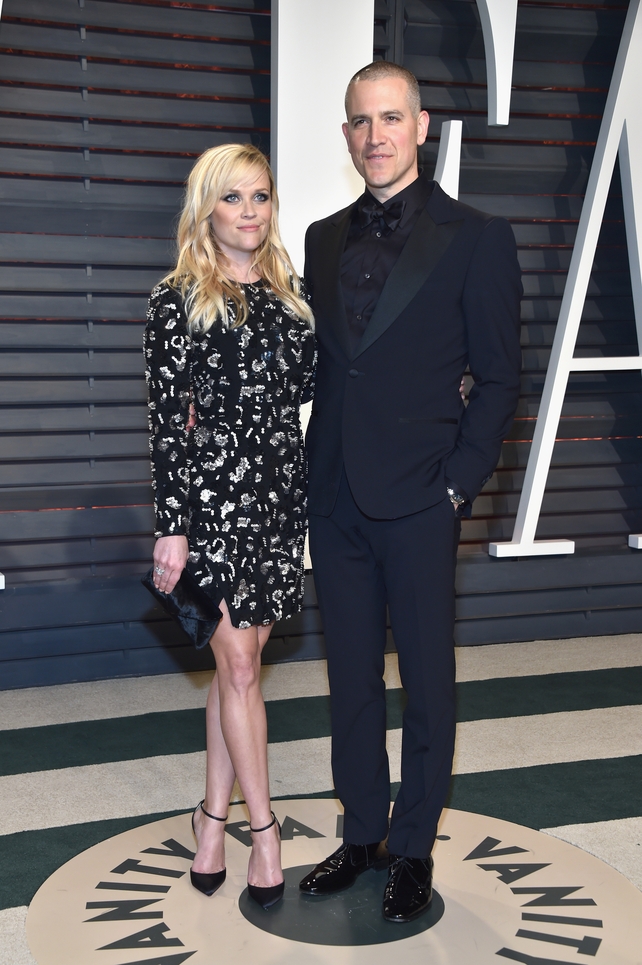 Reece Witherspoon wore a long sleeved Michael Kors number to the Vanity Fair party with Jim Toth.