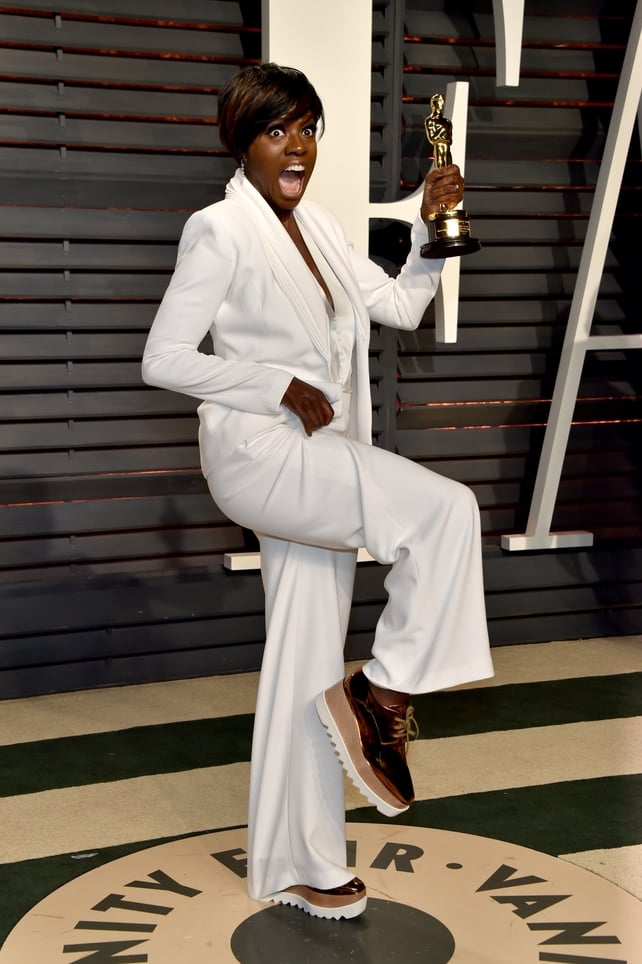 Oscar winner Viola Davis celebrated her award with a stunning white suit and golden platform runners.