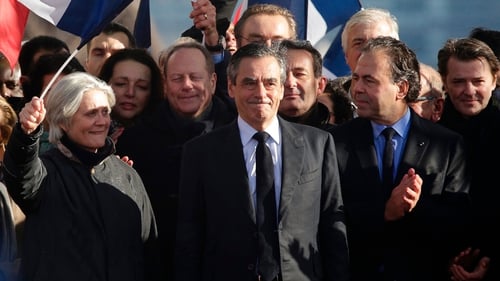 Francois Fillon (C) at a campiagn rally in Paris today with his wife Penelope (L)