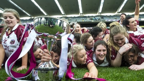 Slaughtneil's players celebrate with the Bill and Agnes Carroll Cup