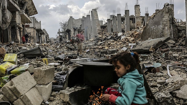 Kurdish Syrian girls among destroyed buildings in the Syrian Kurdish town of Kobane