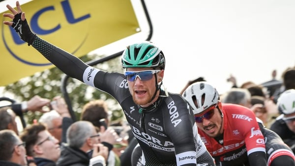 Sam Bennett celebrates as he crosses the finish line ahead of John Degenkolb at the end of the 190 km third stage of Paris-Nice