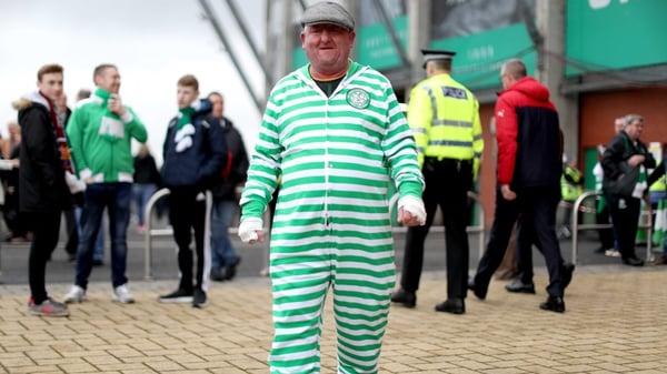 A Celtic fan gets ready for a comfortable win