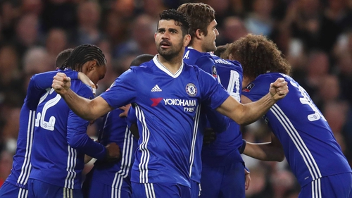 Diego Costa celebrates as Chelsea mob goalscorer N'Golo Kante