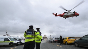 A Coast Guard helicopter arrives in Blacksod to refuel as the search continues