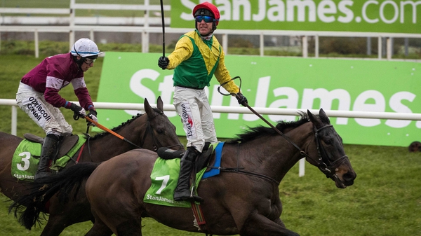 Robbie Power celebrates aboard Sizing John after winning jump racing's blue riband last March