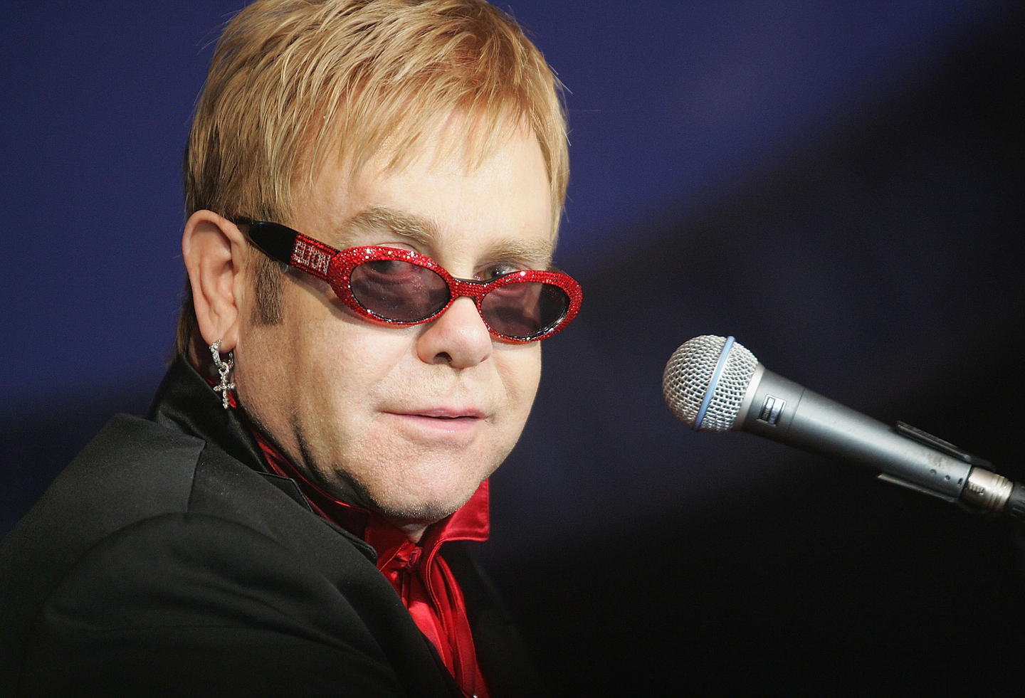 Elton John Sunglasses Photos - 50 Years of Elton John's Fabulously