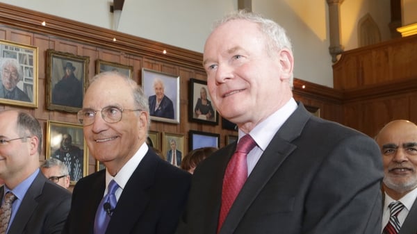Former US Special Envoy for Northern Ireland George Mitchell (L) with Martin McGuinness on a visit to Belfast in 2015