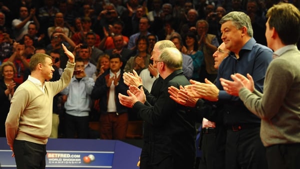 Stephen Hendry (L) waves goodbye to the Crucible crowd in 2012