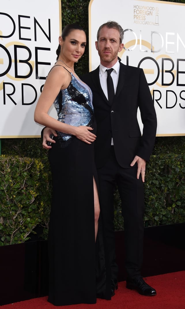 Pregnant Gal is a mesmerizing beauty in this Mugler gown at the Golden Globe Awards earlier this year. She's accompanied by her husband Yaron Varsano.