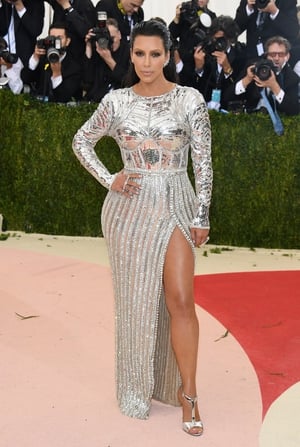 Kim Kardashian in a metallic Balmain gown at the Met Ball in 2016. The Kardashian clan are huge fans of this designer.