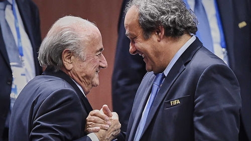 Michel Platini (R) has taken a swipe at Sepp Blatter