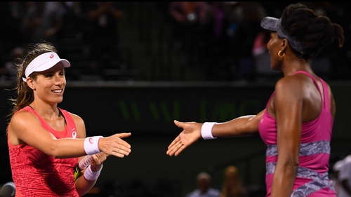 Johanna Konta is congratulated by Venus Williams at the end