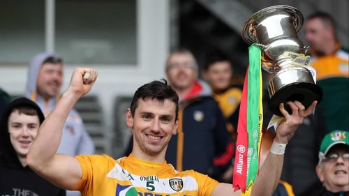 Antrim's Simon McCrory lifts the Division 2A trophy after victory in News