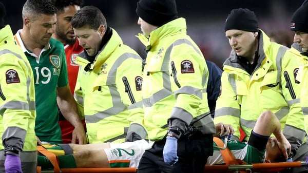 Jon Walters helps Seamus Coleman after the captain suffered a double leg break