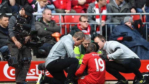Sadio Mane receives treatment on the Anfield turf