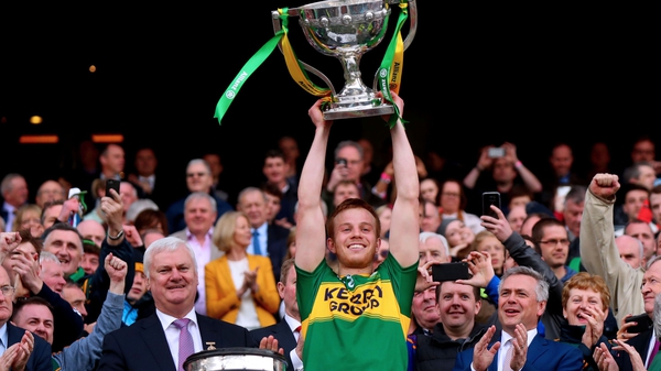 Kerry captain Fionn Fitzgerald lifts the trophy
