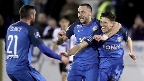 Tim Clancy, Aaron Greene and Keith Buckley celebrate at Oriel Park