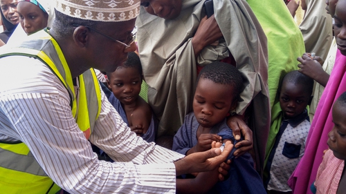 A doctor vaccinates a child against meningitis in Dakwa village, Bwari, Nigeria