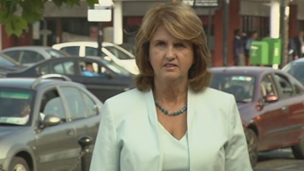 Joan Burton said the protesters used extreme language which was 'full of venom and hatred'