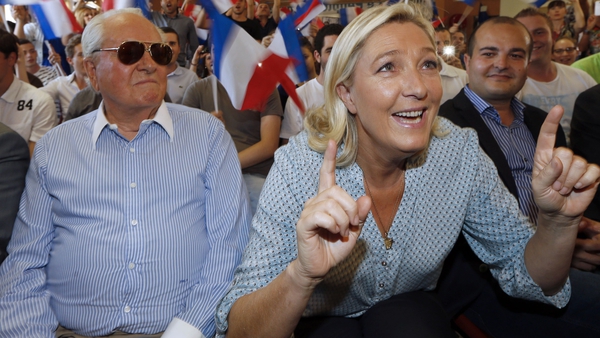 Jean-Marie and Marine Le Pen at a National Front event in 2014