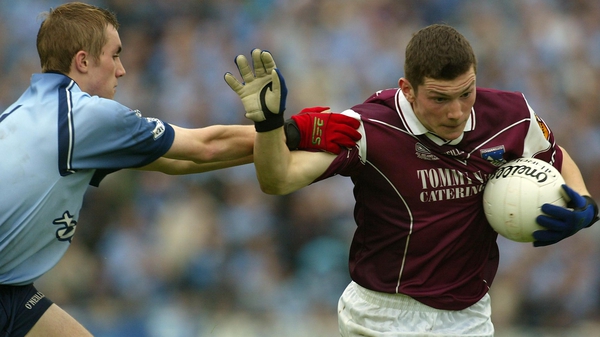 Michael Meehan pushes past Paul Griffin in the 2002 All-Ireland Under-21 final between Galway and Dublin