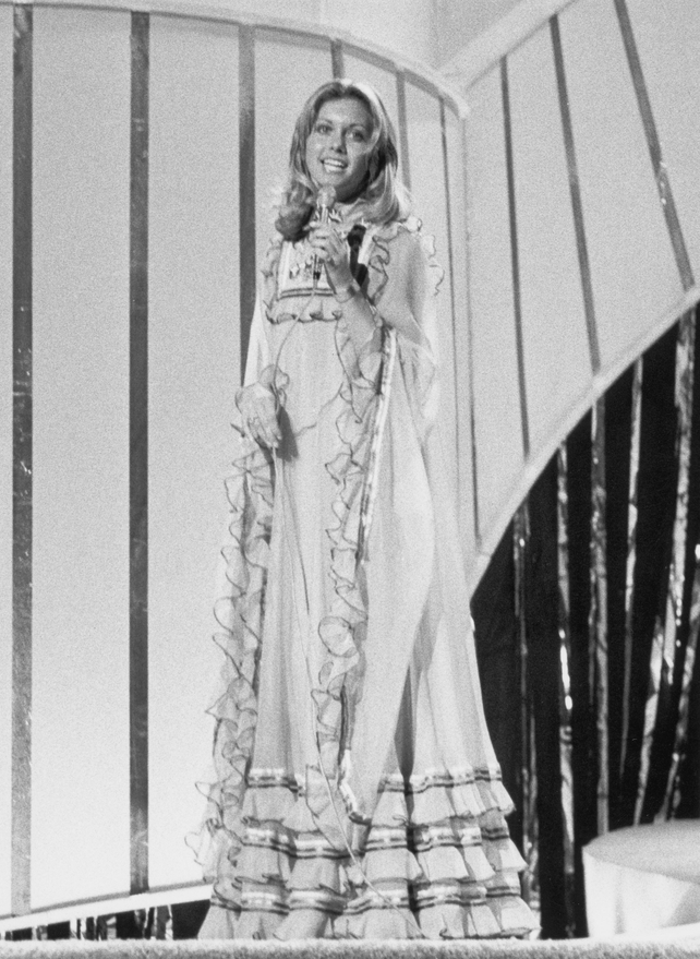 Did you know that 'Grease' actress Olivia Newton-John performed for the United Kingdom in 1974? She sang her song 'Long Live Love' in a seventies maxi dress and finished in 4th place.