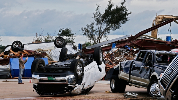 A local car dealership is destroyed after a large tornado struck near Canton, Texas