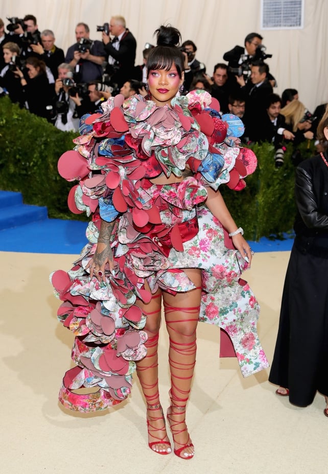 Rihanna loves taking risks! She's the only girl in the world who can rock in this Comme des Garçons floral layered dress and 'Rihanna Loves Chopard' jewelry!