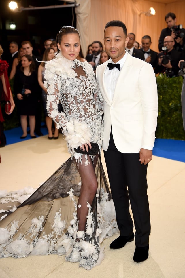 Chrissy Teigen in custom Marchesa and John Legend in Burberry. Adorably stylish.