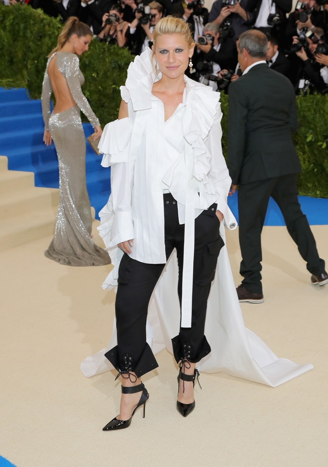 Claire Danes was creative wearing a Monse white blouse with Fred Leighton jewellery and black trousers.