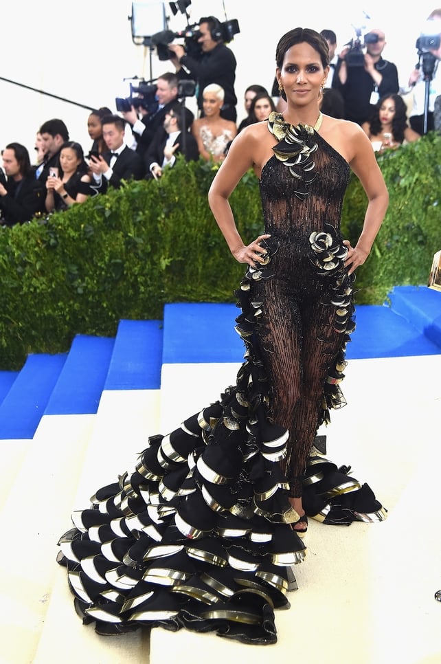 What a dress! Halle Berry stunned in Versace and Atelier Swarovski earrings. The black and gold petal train is perfection.