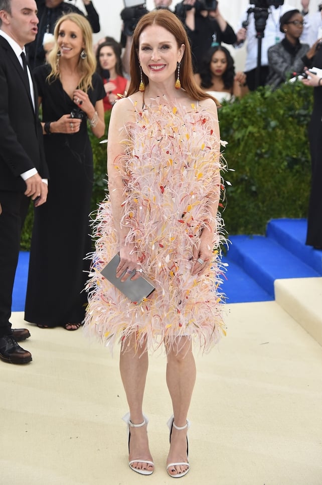 Julianne Moore exudes happiness in a Calvin Klein By Appointment dress and Chopard jewelry.