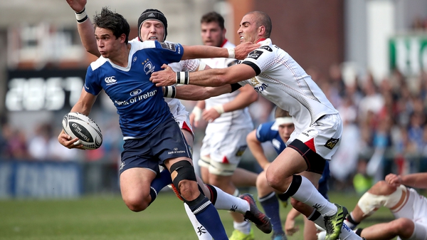 Leinster's Joey Carbery (L) is tackled by Ulster's Ruan Pienaar