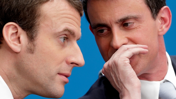 Manuel Valls (R) is the first high-profile defection since the election win of Emmanuel Macron (L) on Sunday