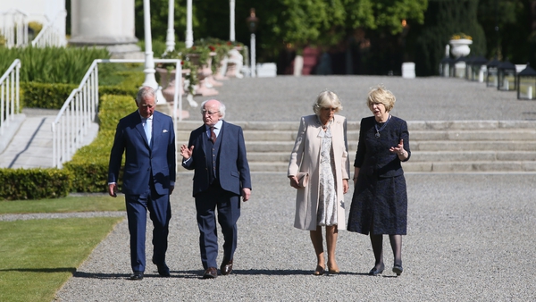 Prince Charles and the Duchess of Cornwall walk with President Michael D Higgins and his wife Sabina