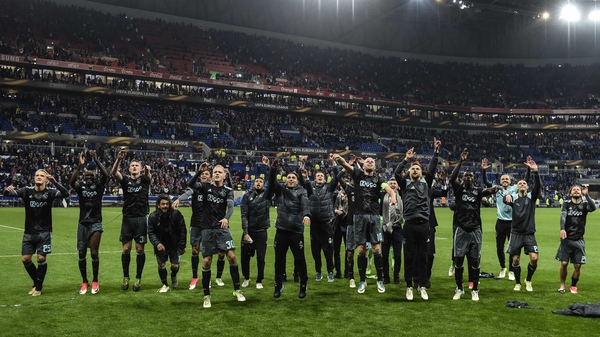 Ajax's youthful squad celebrate securing a place in the Europa League final