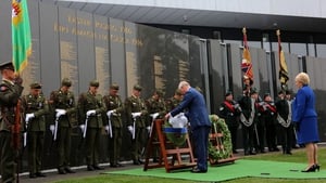 Charles lays a wreath at the Necrology Wall