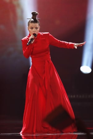 Lithuania sees red! Fusedmarc represented Lithuania with her song 'Rain of Revolution' in a red gown and Japanese-inspired hair bun.
