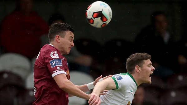 Galway's Marc Ludden and Garry Buckley of Cork City contest the ball in the air