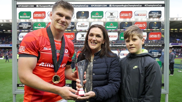 Owen Farrell is presented with the Anthony Foley Memorial Award by Anthony's wife Olive and their son Tony