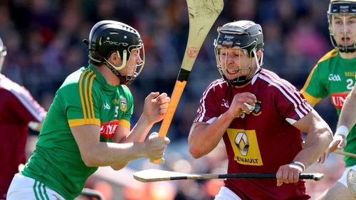 Westmeath's Robbie Greville evades the challenge of Meath's Darragh Kelly