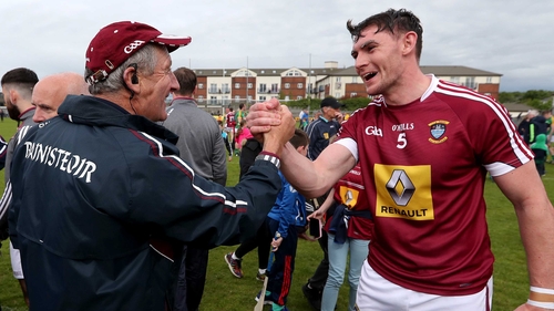 Michael Ryan () congratulates Aaron Craig after Westmeath's win against Meath